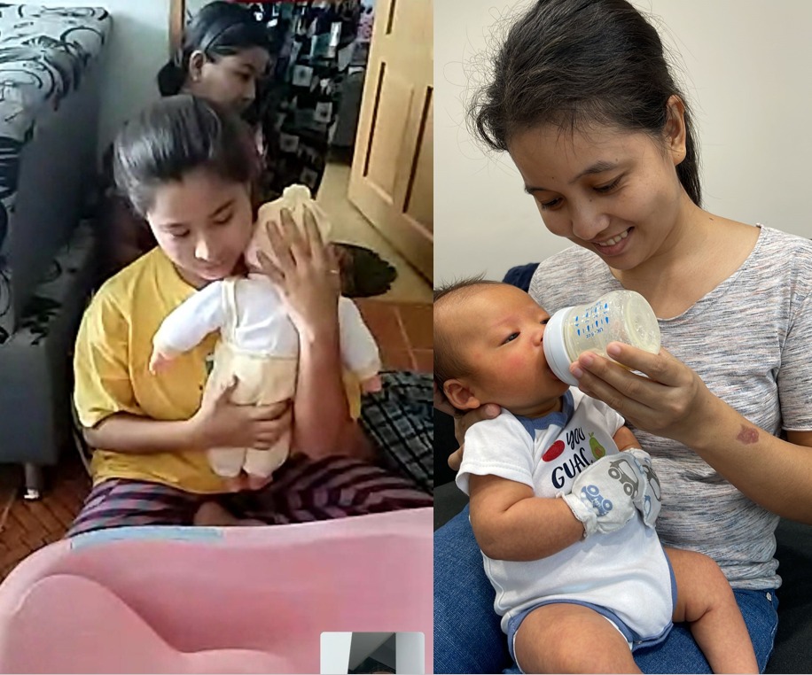 Helper gently feeding an infant