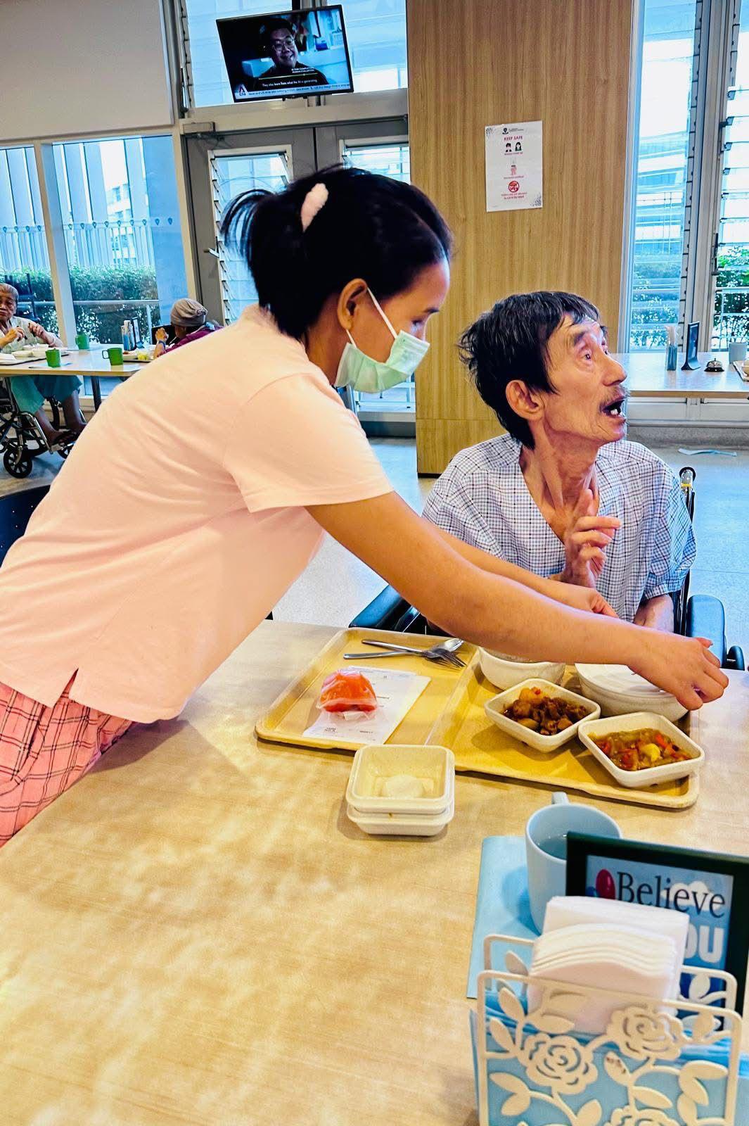 Four helpers learning Singapore cooking during in-house training
