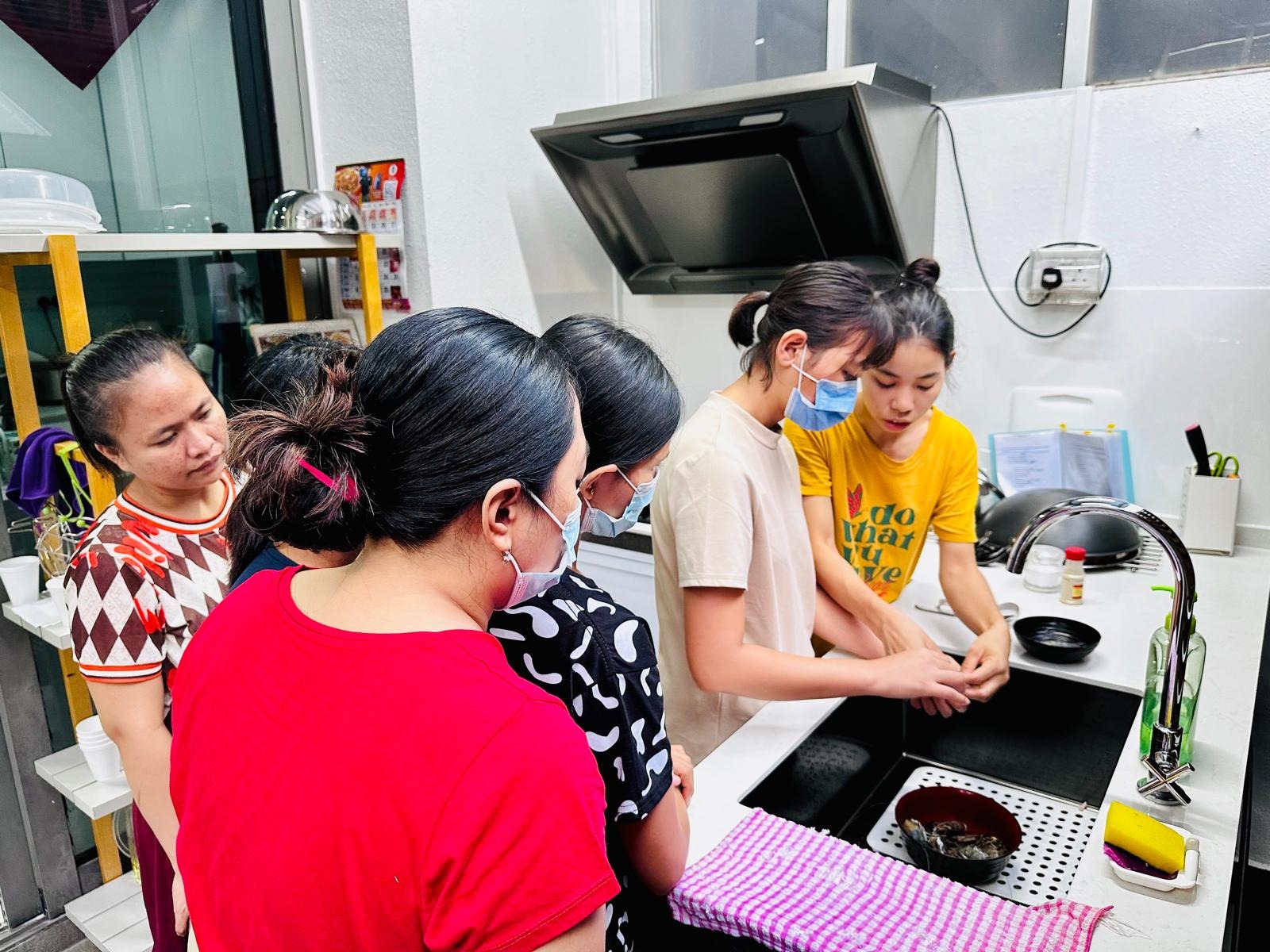 Helpers training together in our kitchen