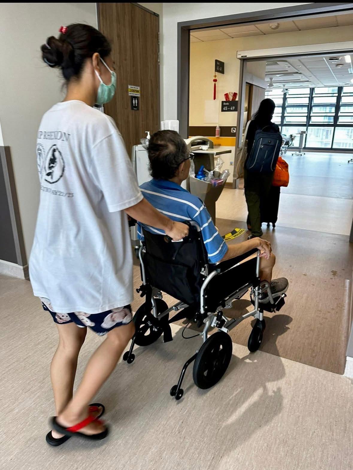 Caregiver providing bedside care to hospital patient