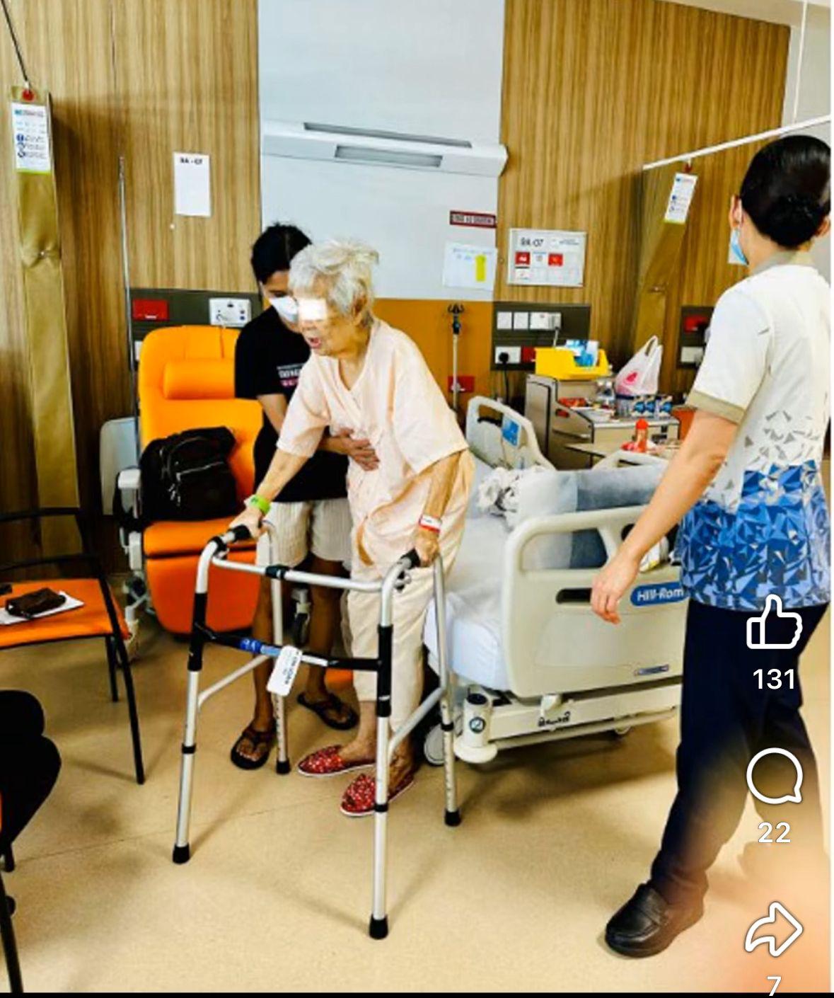 Caregiver helping elderly patient with feeding